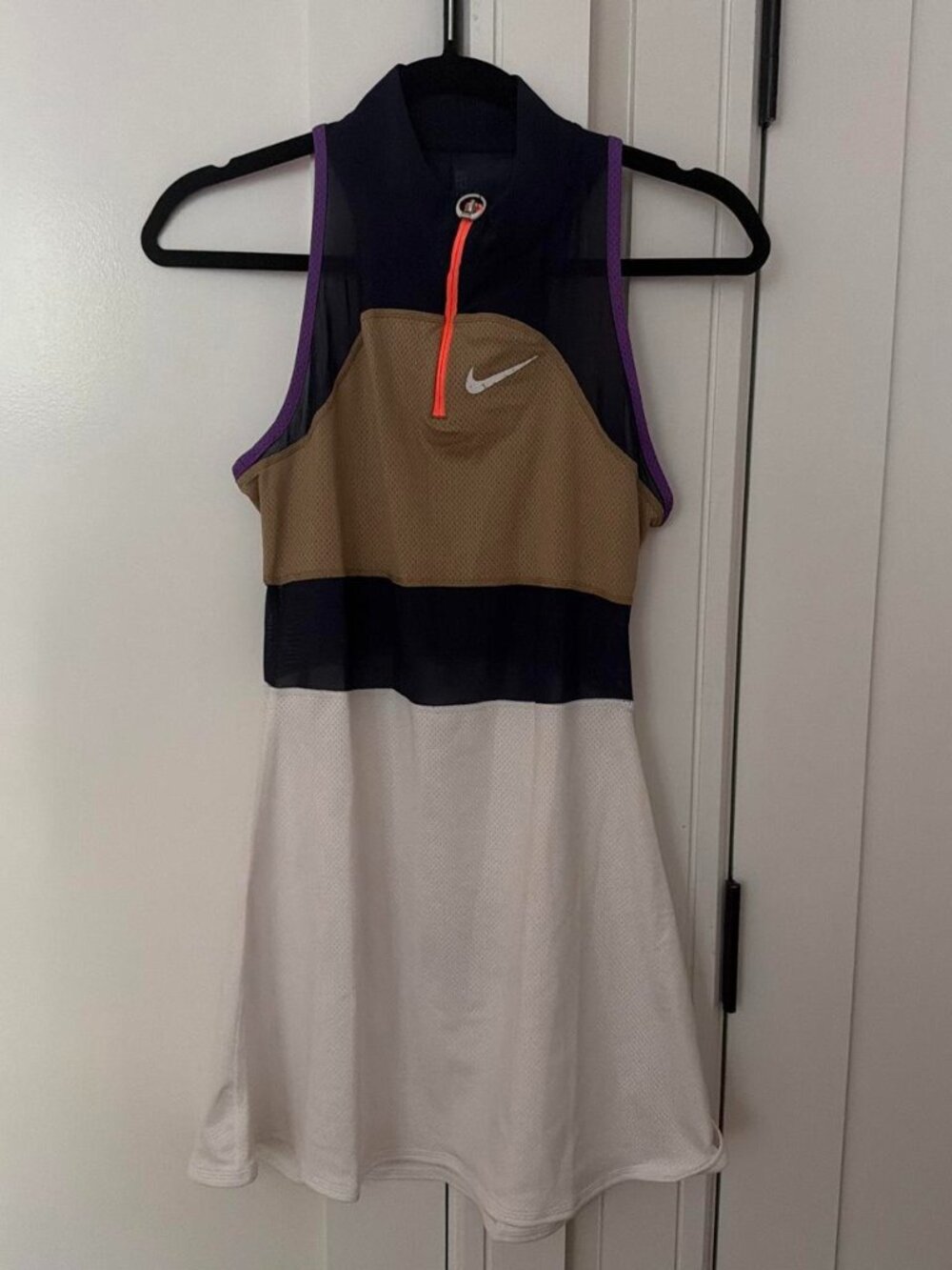 Nike tennis dress with color blocking in navy, orange, beige, and white